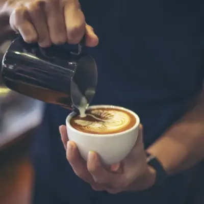 Close Up Hands Barista Make Latte Coffee Art Paint