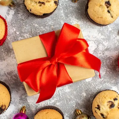 Close Up View Gift With Red Ribbon Freshly Baked Delicious Small Cupcakes Decoration Accessories Ice Surface